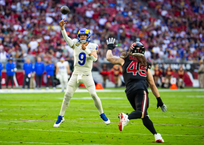 Nov 26, 2023; Glendale, Arizona, USA; Los Angeles Rams quarterback Matthew Stafford (9) throws a touchdown pass against the Arizona Cardinals in the first half at State Farm Stadium. Mandatory Credit: Mark J. Rebilas-USA TODAY Sports